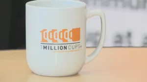 1 Million Cups logo on a white coffee mug.