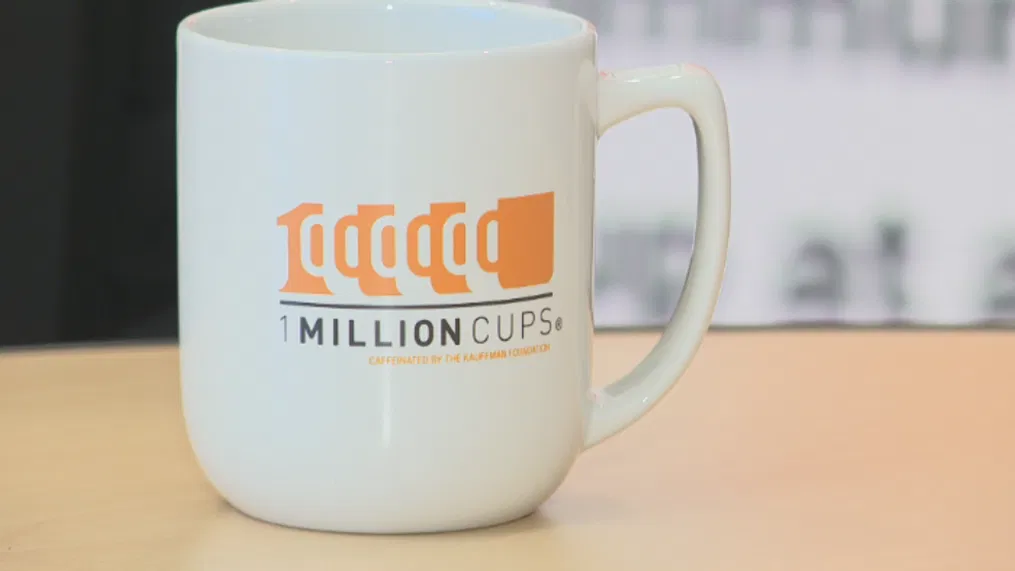 1 Million Cups logo on a white coffee mug.