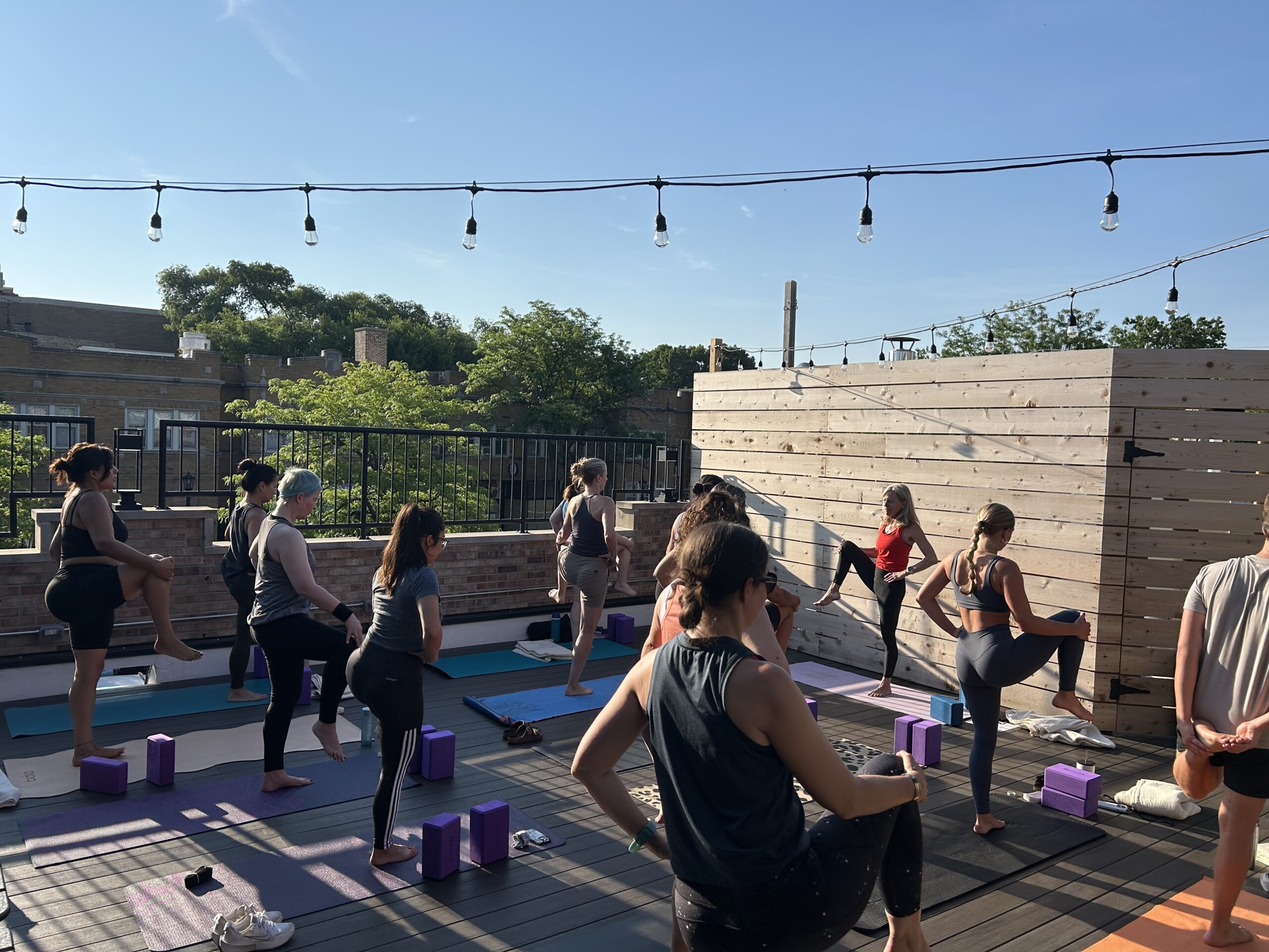 Rooftop Yoga – Newsletter U3 Coffee Cafe & Roastery featuring with 13 people doing rooftop yoga